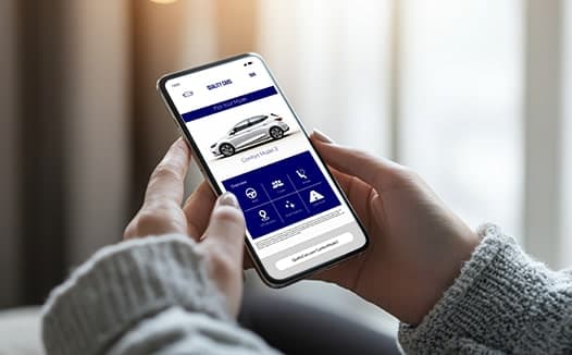 Close-up of someone browsing a dealership’s mobile inventory page showing a vehicle listing powered by addressable automotive advertising technology.