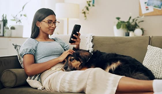 Woman browsing on her smartphone, showing how advertisers reach users through addressable digital advertising on mobile.