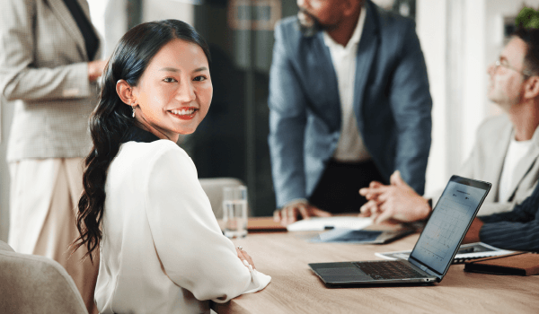 Happy woman with a laptop in front of her