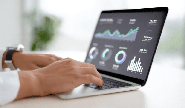 Image: A clean analytics dashboard visual featuring rising lead metrics, website actions, and offline visit tracking—designed to look like performance improving over time.
